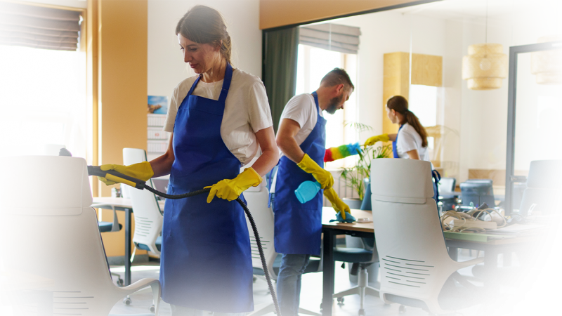 professional-cleaning-service-person-using-vacuum-cleaner-office