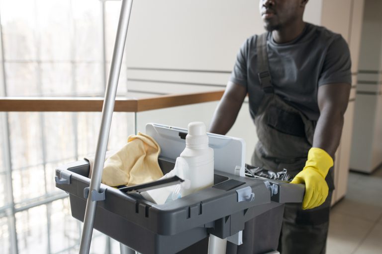 man-walking-with-cleaning-cart